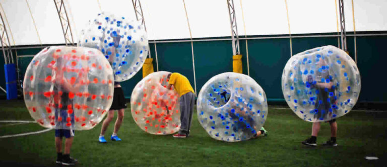 Playing in inflatable balls in a sports hall